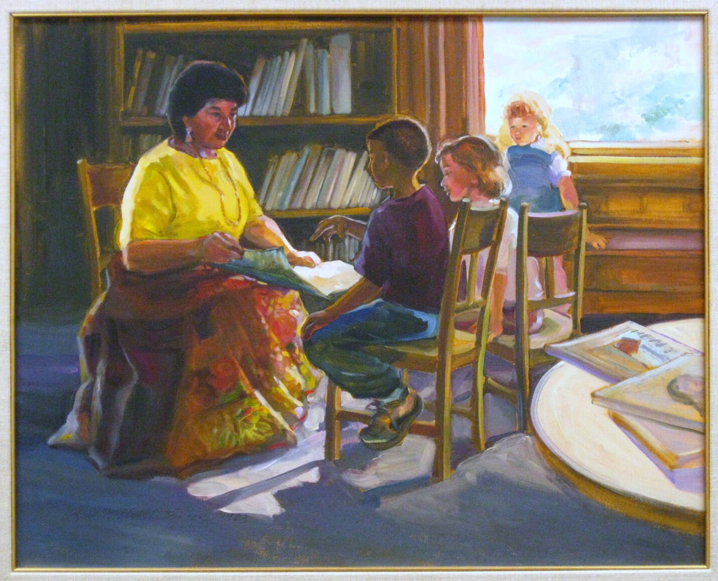 Woman in long skirt and yellow shirt reading to three children. All are sitting in chairs.